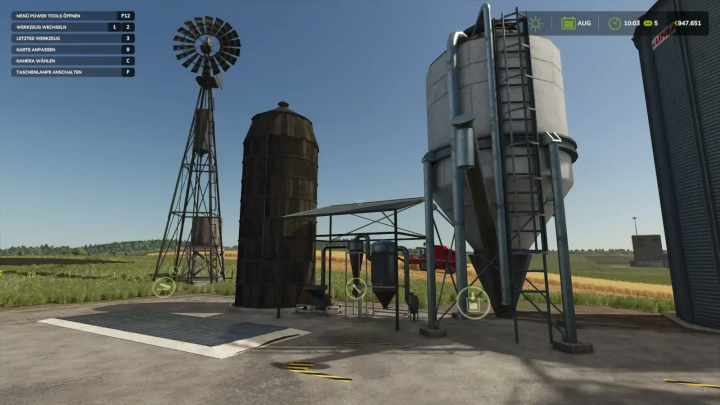 fs25-mods,  FS25 Fermenter mod showing silo and windmill structures in a farm setting.