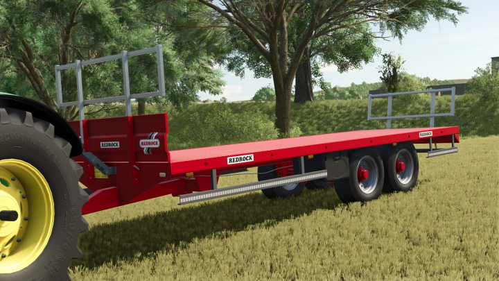 fs25-mods, Redrock 24ft Bale Trailer mod in FS25, showcasing a bright red flatbed trailer with trees in the background.