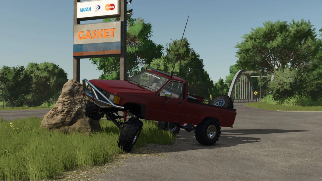 1984 Toyota Hilux mod in FS25, displayed on rough terrain near Gasket sign. Enhances realism and exploration in Farming Simulator 25 mods.