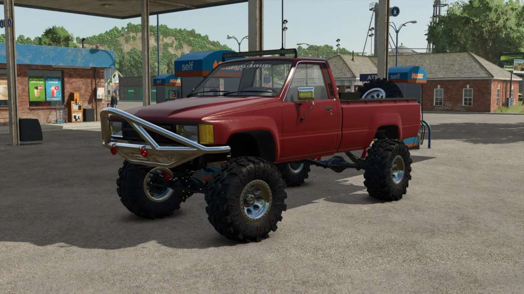 1984 Toyota Hilux mod in FS25 with lifted suspension, featured at a gas station in Farming Simulator 25.