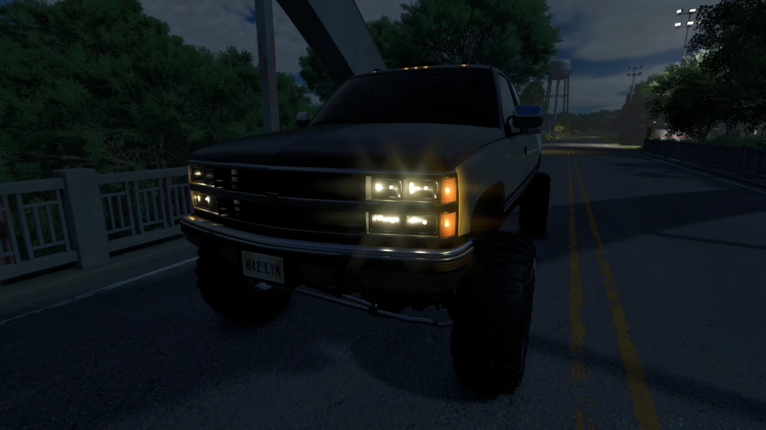 1990 Chevy K2500 mod in FS25 at night with headlights on