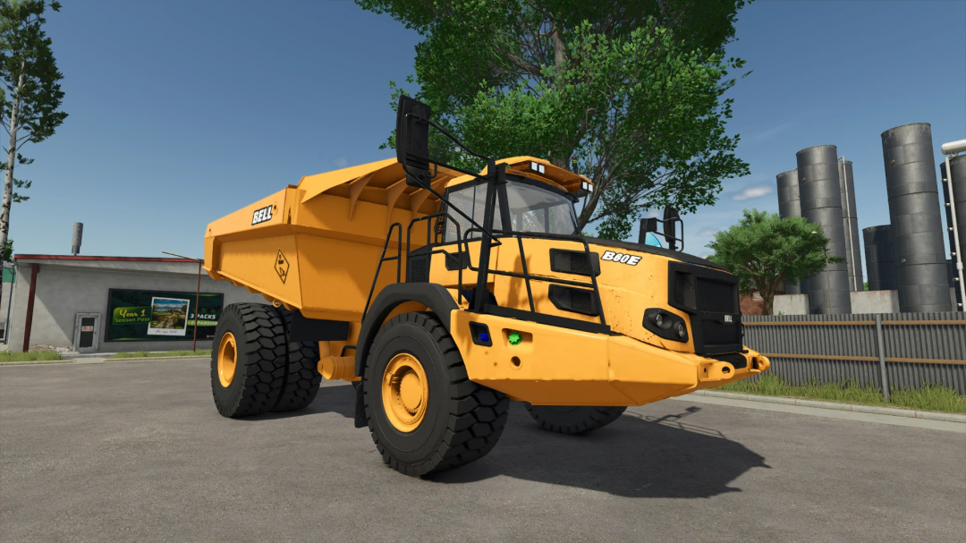 FS25 mod Bell B60E v1.0.0.0 dump truck in a parking lot, used in Farming Simulator 25.