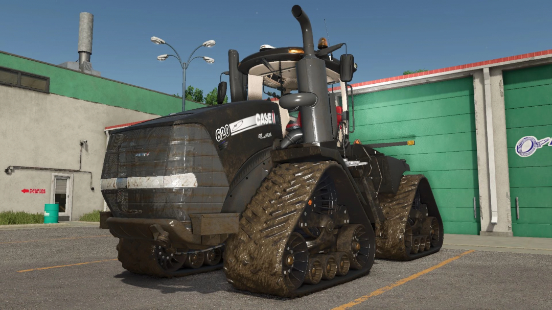 FS25 mod Case IH Quadtrac 2013 v1.0.0.0 tractor parked in front of a green building.