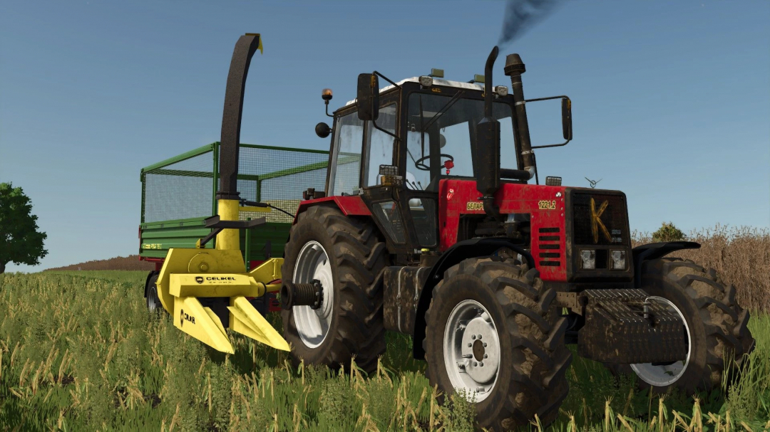 FS25 mod Celikel v1.0.0.0 showcasing a red tractor with yellow Celikel attachment on a grassy field.