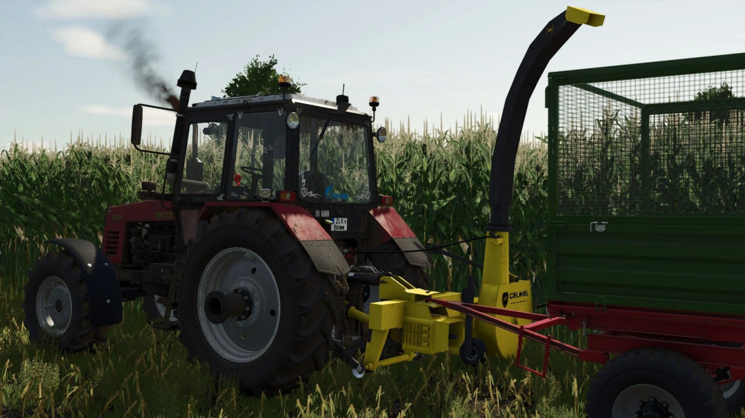 FS25 mod Celikel v1.0.0.0 featuring a tractor towing a trailer in a cornfield.