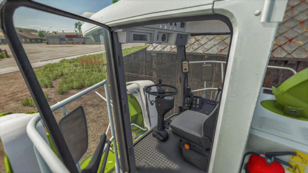 Interior view of Claas Jaguar 800 mod in FS25, showing steering wheel and controls.