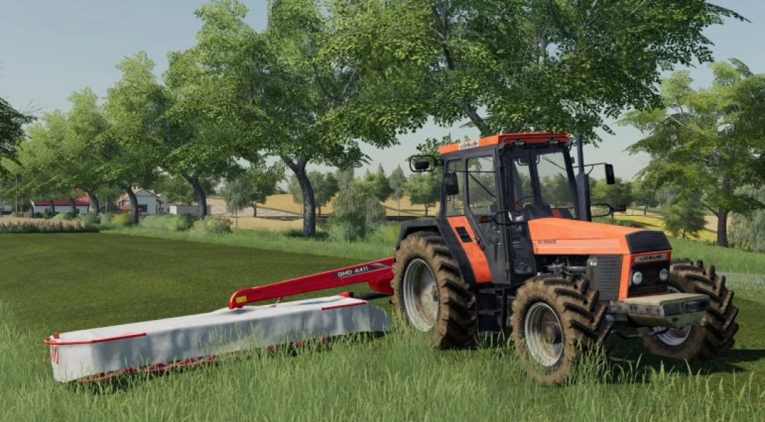 FS25 Ursus 1634 tractor mod with mower attachment in a grassy field, Farming Simulator 25 mods.