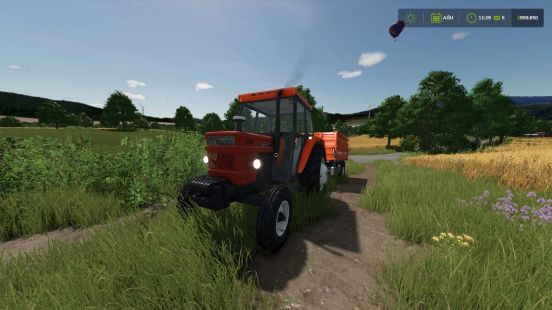 Fiat 480/640 Kabinli mod in FS25, showing a tractor on a dirt path in a farm landscape.