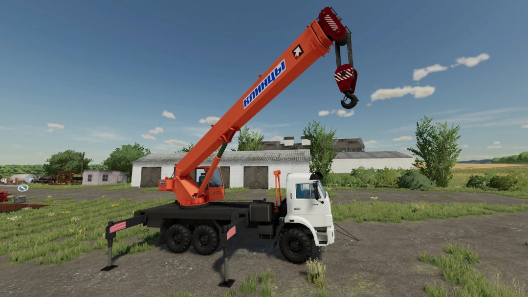 FS22 mod KamAZ Klintsy 6x6 Crane in a farm setting, featuring a white truck with an orange crane, Farming Simulator 22.