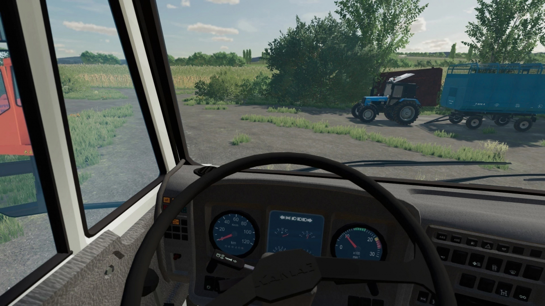 FS22 mod KamAZ Klintsy 6x6 crane interior view with farmland scene outside, showcasing tractor and trailer.