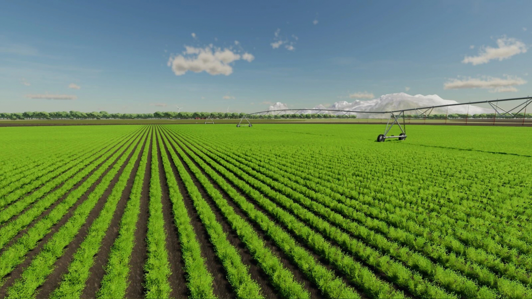 A vast, green farm field with irrigation system on the Lexington Map in FS22 mods.