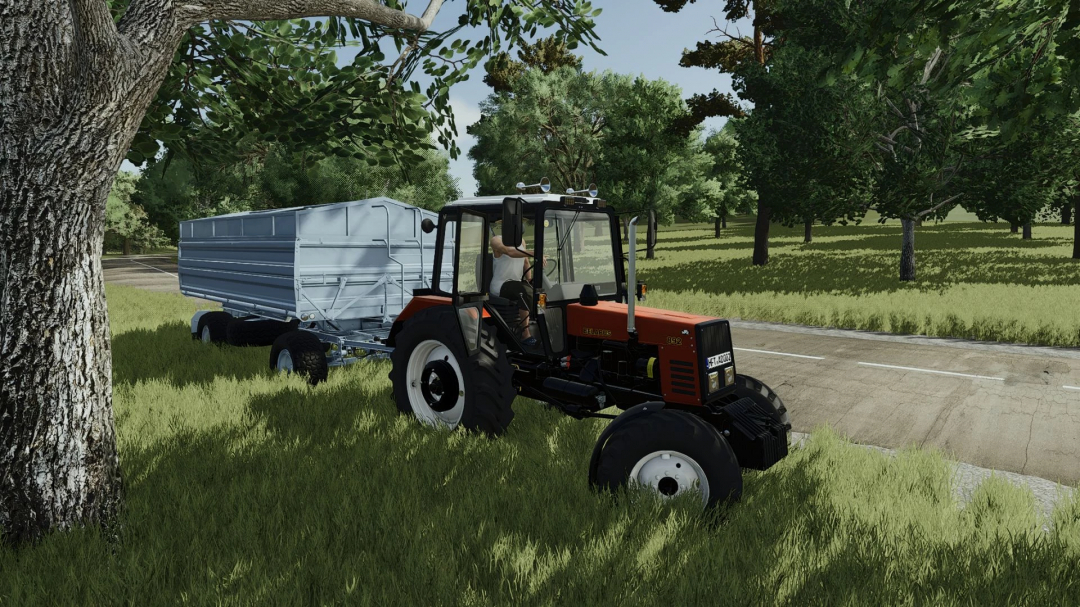 MTZ 892 tractor with trailer in FS25 mod, set in a lush green field scene.