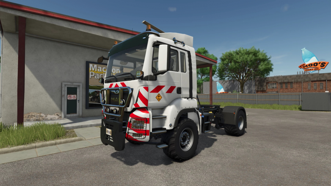 FS25 mod Man TGS 18.500 v1.0.0.0 truck parked near a building in Farming Simulator 25.