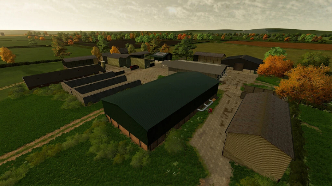 Aerial view of farm buildings in Pidnell Map mod for FS22, showcasing barns and fields.