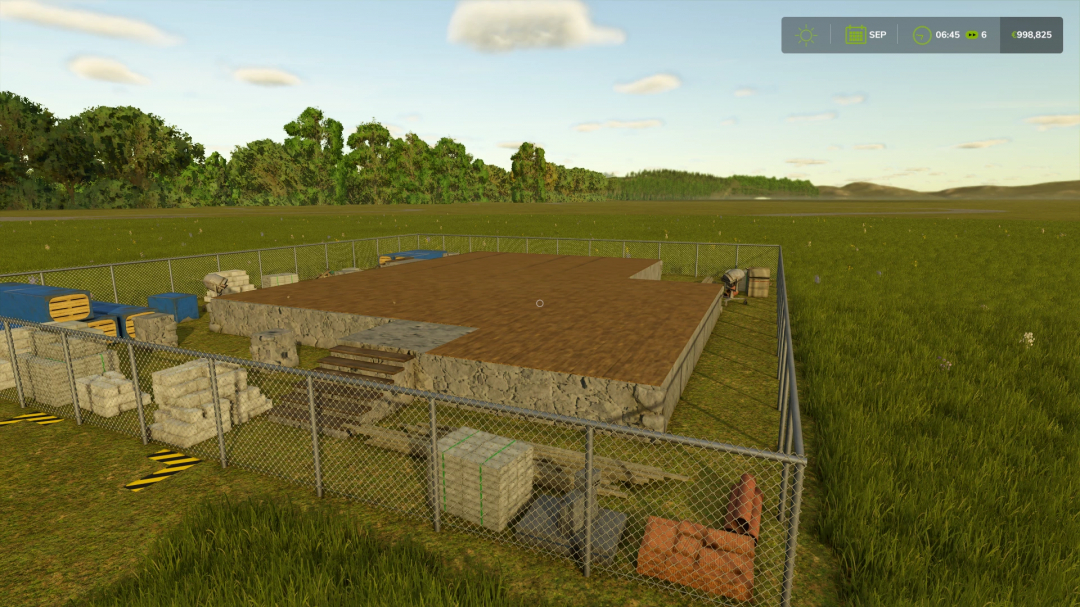 Foundation of the Redbrick House to Build mod in FS25, set on a grassy field, surrounded by construction materials.