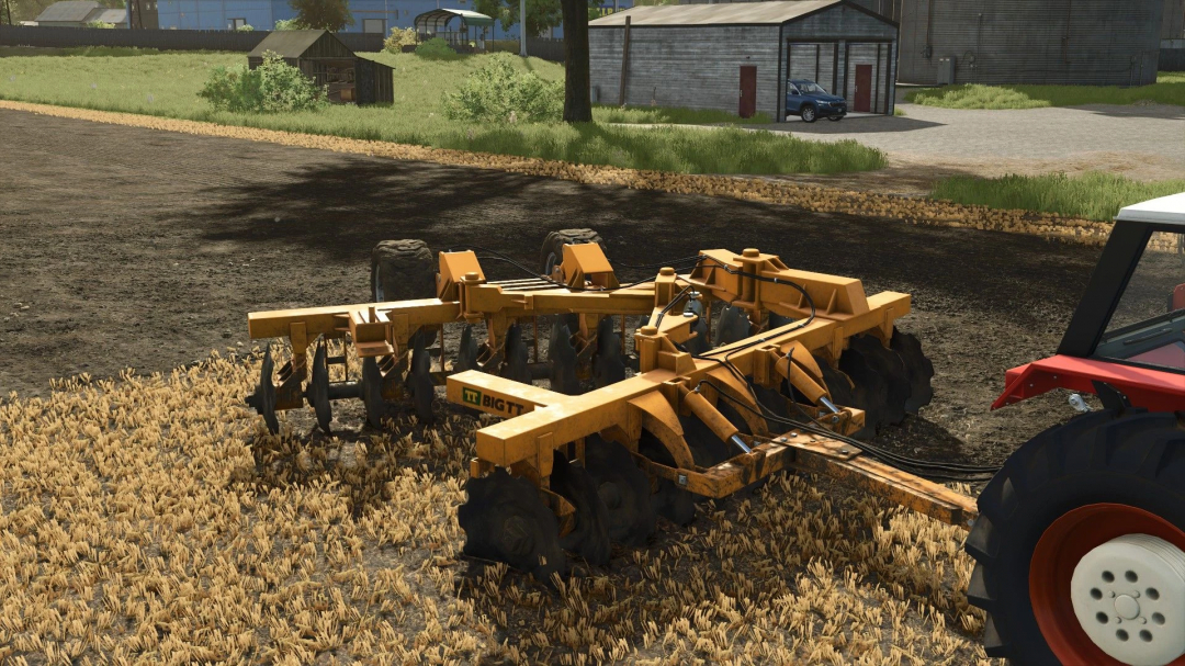 TT Big TT mod in Farming Simulator 25, showing a yellow disc harrow attached to a tractor on a farm.