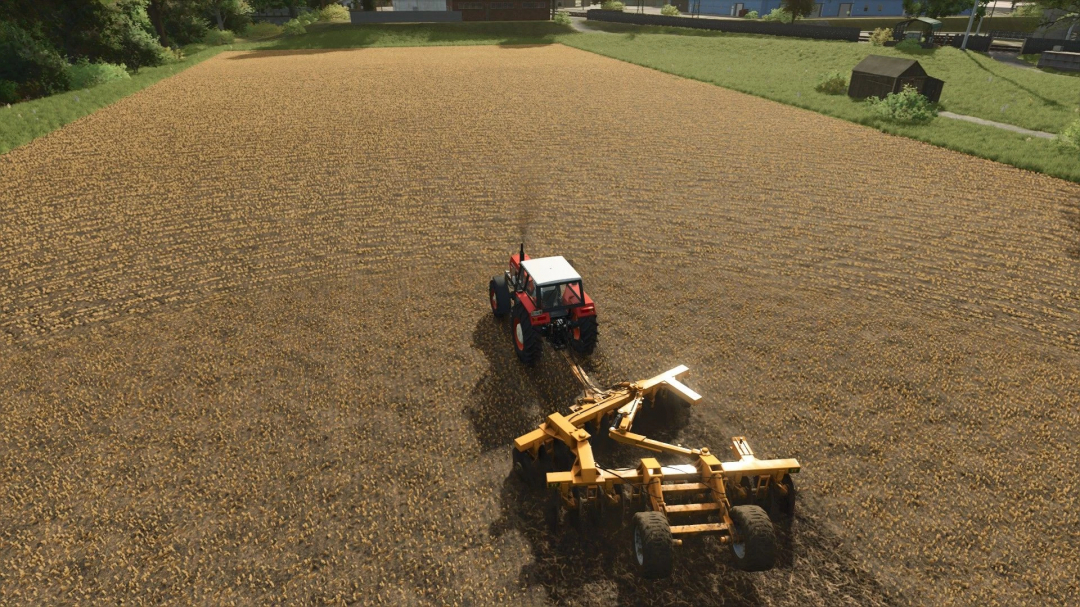 FS25 mod TT Big TT v1.0.0.0 showing a tractor plowing a large field under clear skies.