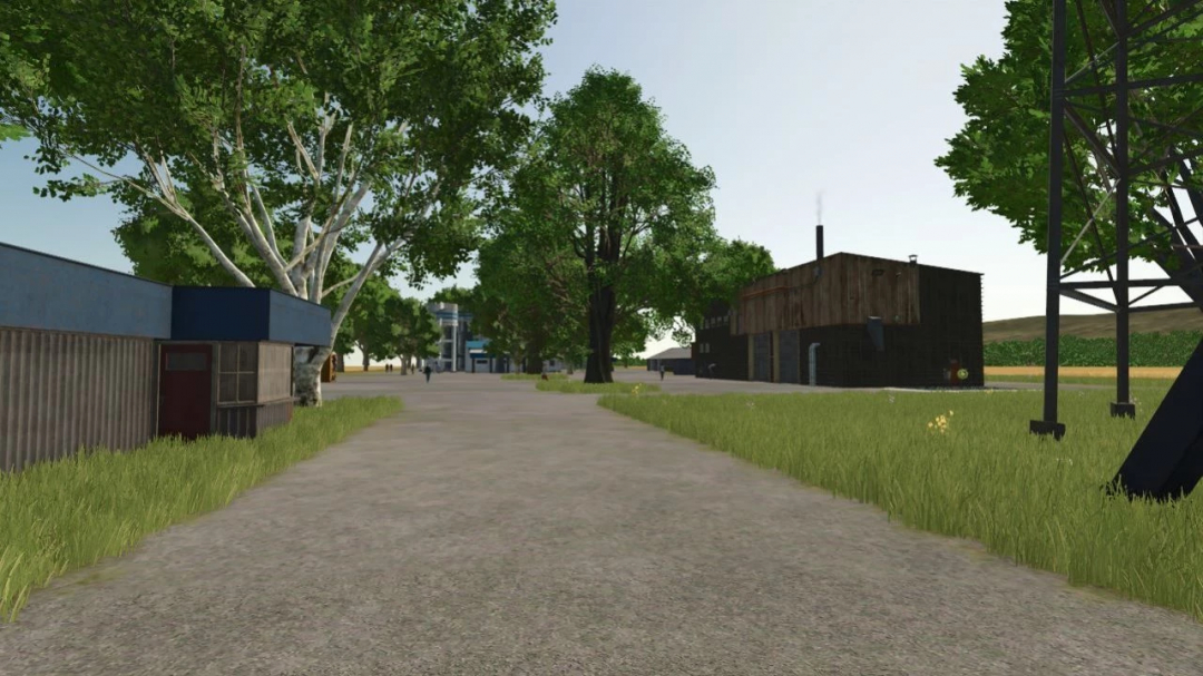 US Farmer v1.0.0.2 mod scene in Farming Simulator 25, featuring rural landscape and buildings.