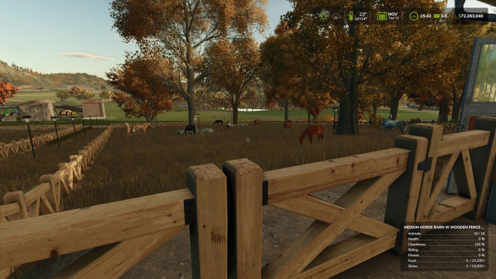 fs25-mods,  FS25 mod: Medium Horse Barn with Wooden Fence AUTOWATER. Image shows a fenced horse pasture with autumn trees.