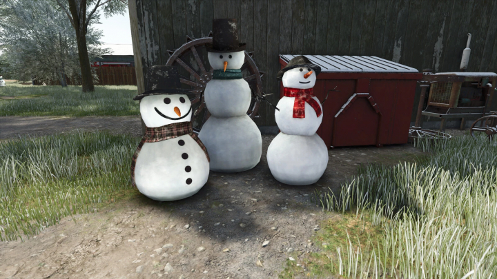 fs25-mods,  Three snowmen with hats and scarves from the Placeable Snowman Pack mod in FS25, set outdoors on grass.