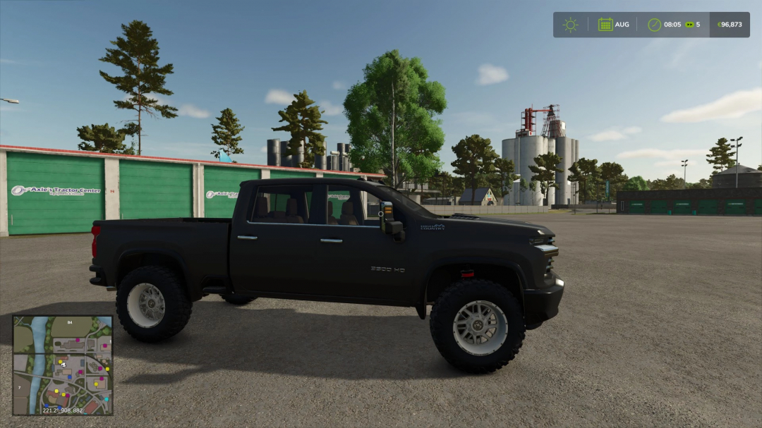 Chevrolet Silverado 2500 High Country mod in FS25, parked by industrial buildings.