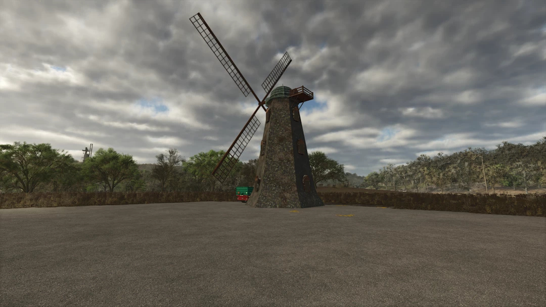 Old English Windmill mod in Farming Simulator 25, set under a cloudy sky with trees in the background.