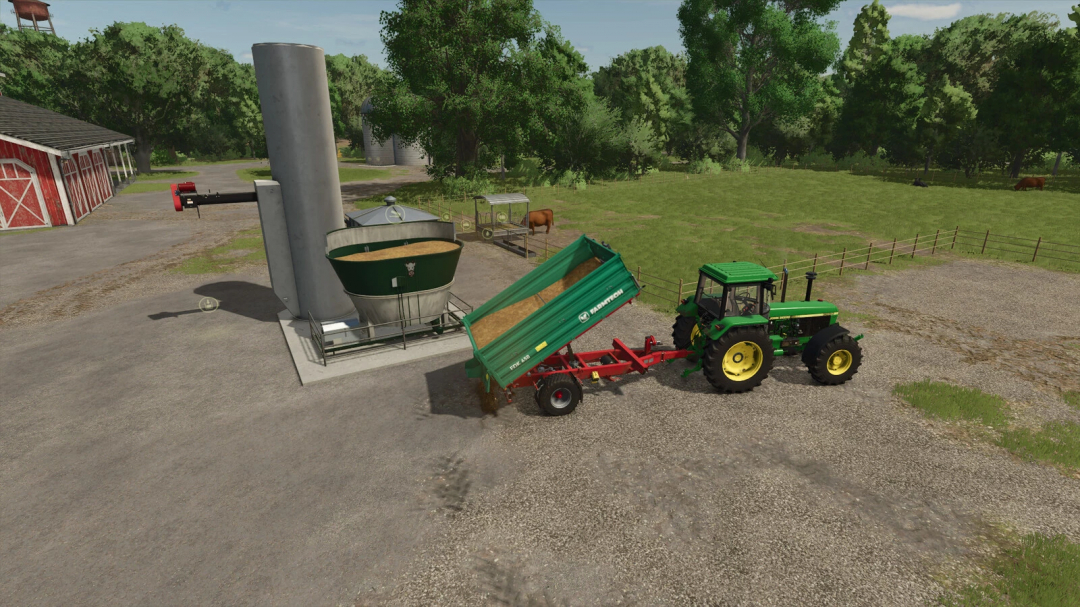 FS25 mods: Tractor unloading at feed mixing plant in Farming Simulator 25.