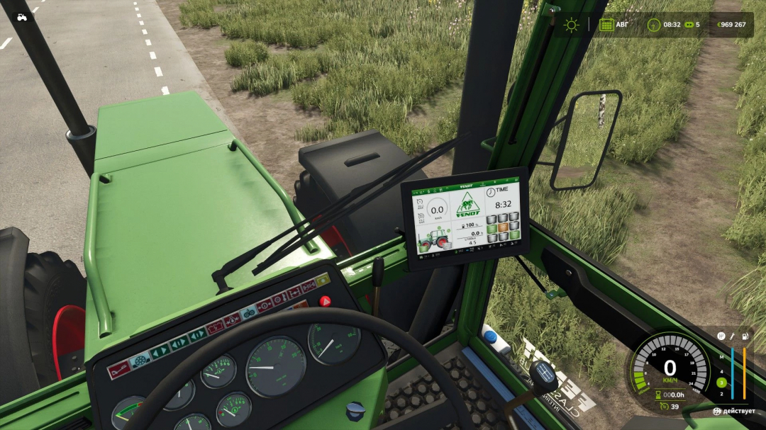 View from inside Fendt 600 LS tractor in FS25, showing dashboard and digital display on a rural road.