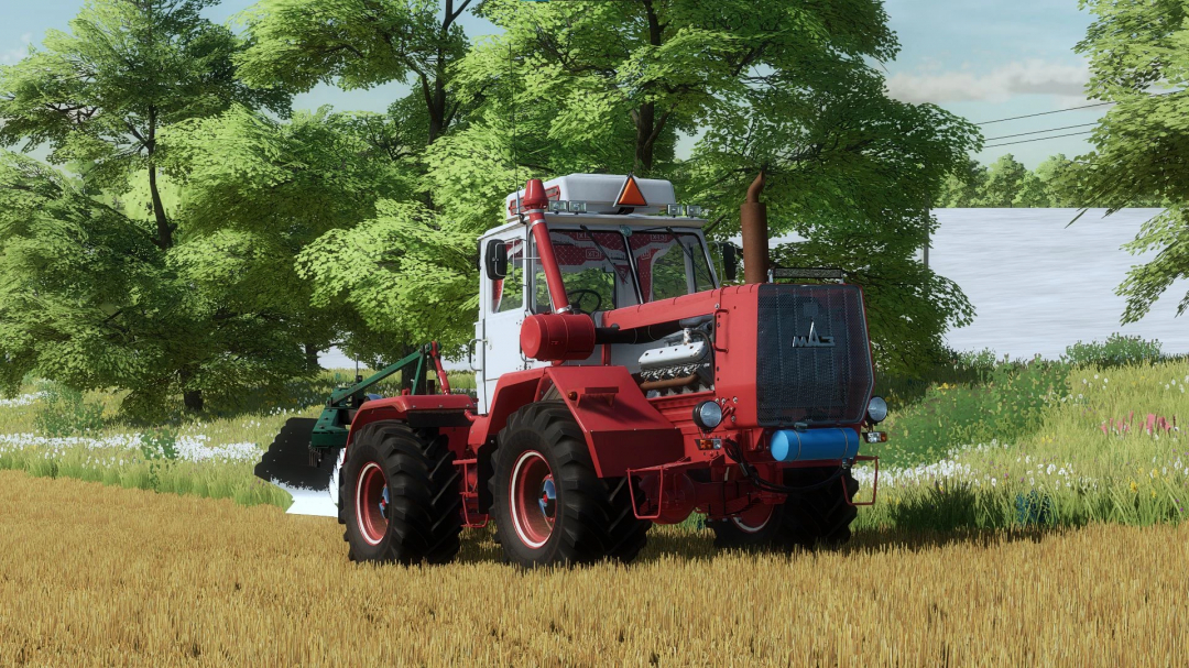 HTZ T-150K V8 tractor mod on a field in FS22, surrounded by green trees.