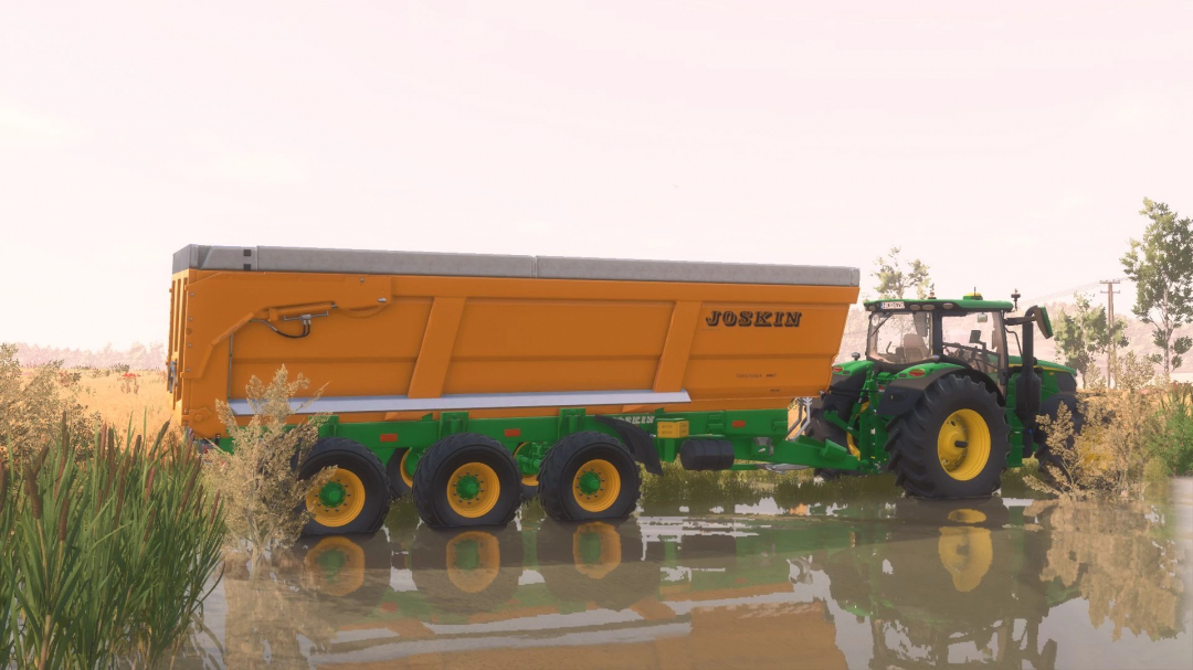 FS25 mod Joskin TransSpace 8000 v2.0.0.0 features a trailer attached to a tractor, parked on a farm field.