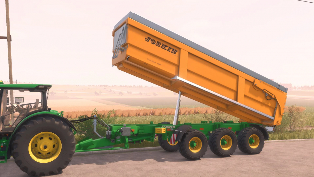 FS25 mod Joskin TransSpace 8000 v2.0.0.0 trailer tipped on a green tractor in Farming Simulator 25.