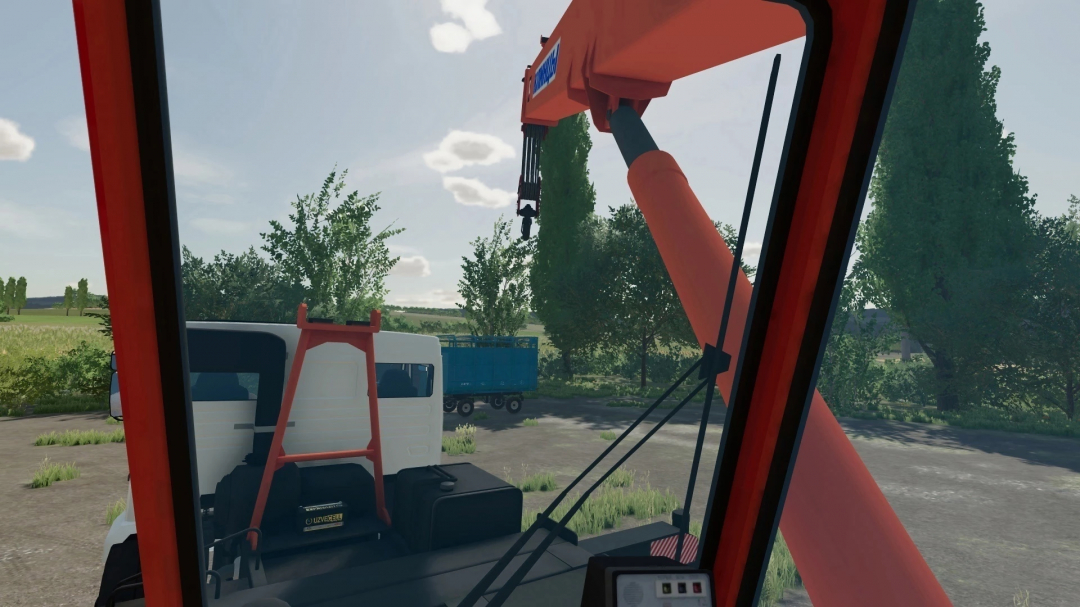 Interior view of KamAZ Klintsy crane mod in FS22, featuring loading area with trees in the background.