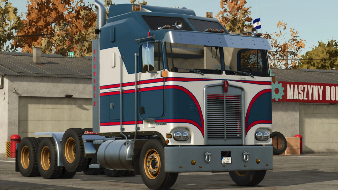 Kenworth K100 truck mod for FS25, featuring vintage design parked in front of a workshop.