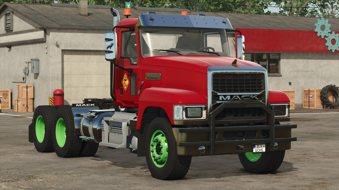 Mack truck mod in FS25, featuring a red cab and green wheels parked at a garage.