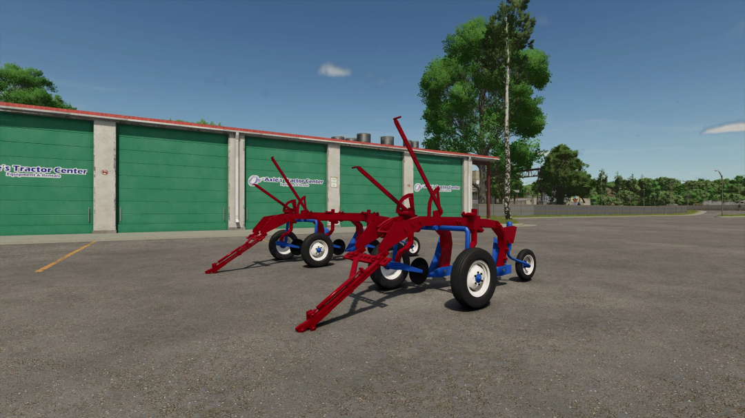 McCormick Deering Little Genius Plows FS25 mod displayed in a parking area, showcasing red and blue metal frame. FS25 mods enhance gameplay.