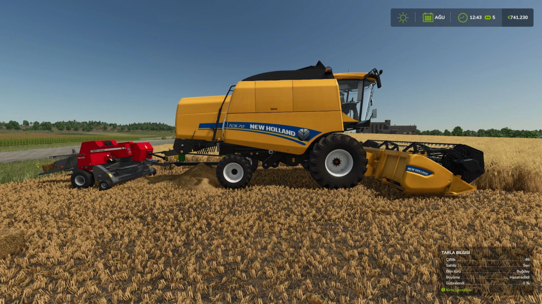 New Holland TC5 harvester in FS25 mod harvesting wheat in Farming Simulator 25.