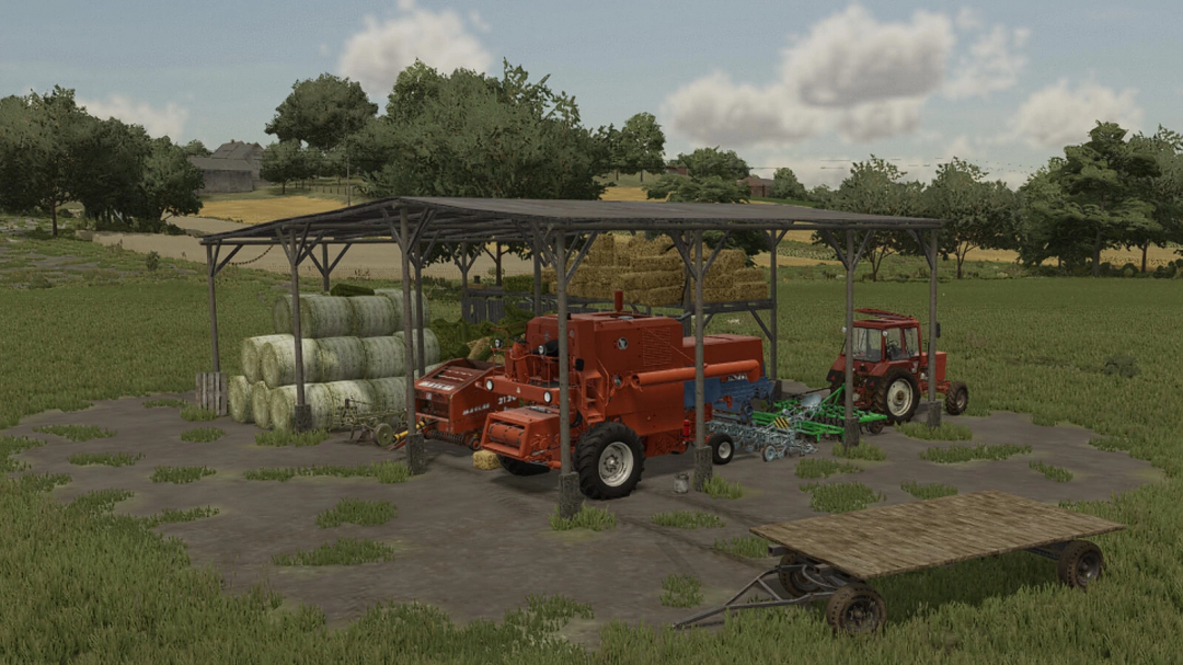 Old Shed in FS25 mod with farm equipment and hay bales in a field.