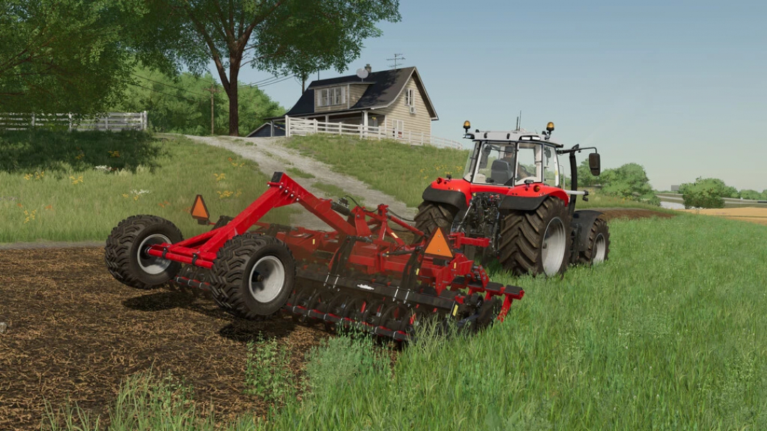 FS22 mod Ozdoken Evodisc Pack v1.0.0.1 showing a red disc harrow attached to a tractor in a lush green field.