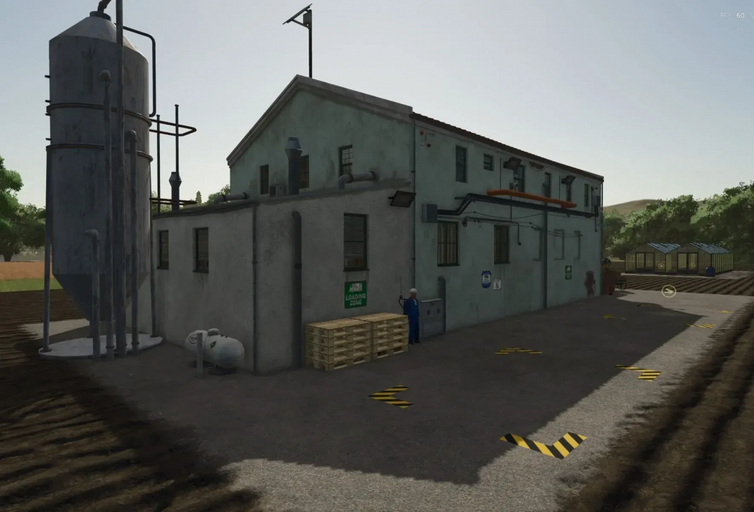 Reis Chips Factory mod in FS25, showcasing an industrial building with tanks and loading area.