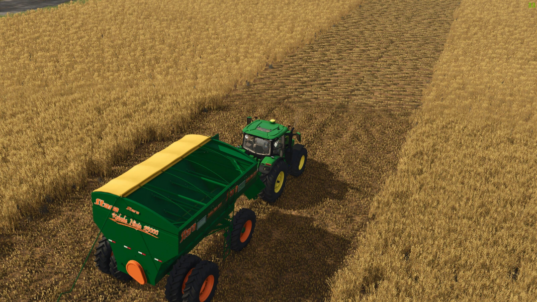 Stara Reboke 25000 mod in FS25, with a tractor hauling the green trailer through a harvested field.