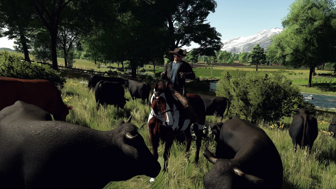 FS22 mod 'The Ranch, Colorado v2.0.0.0' image with rider on horseback among cows in a lush, mountainous landscape.