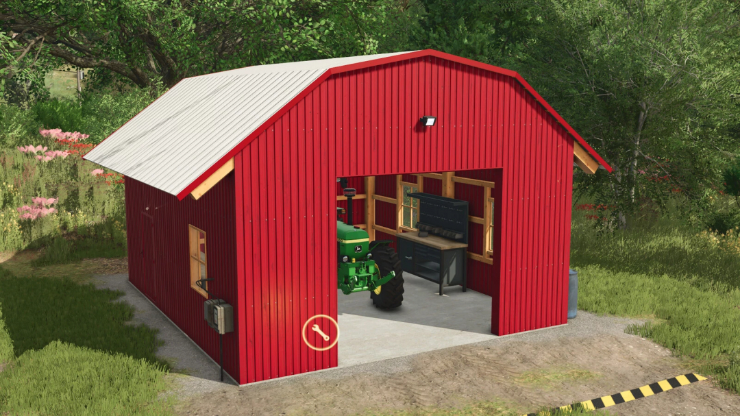 FS25 mod Workshop Shed v1.0.0.0, a red metal workshop with a tractor inside, surrounded by trees.