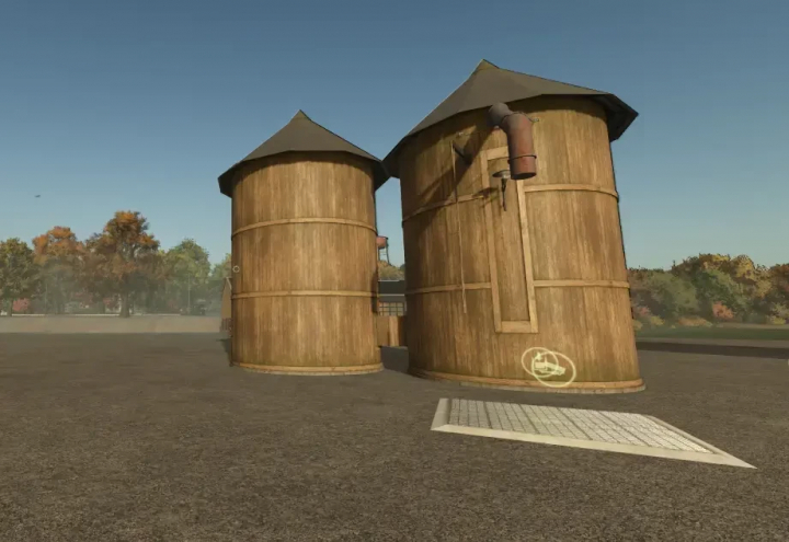 fs25-mods,  FS25 mod Fermenter v1.0.0.0 depicts two large wooden silos on a farm, enhancing realism in Farming Simulator 25.