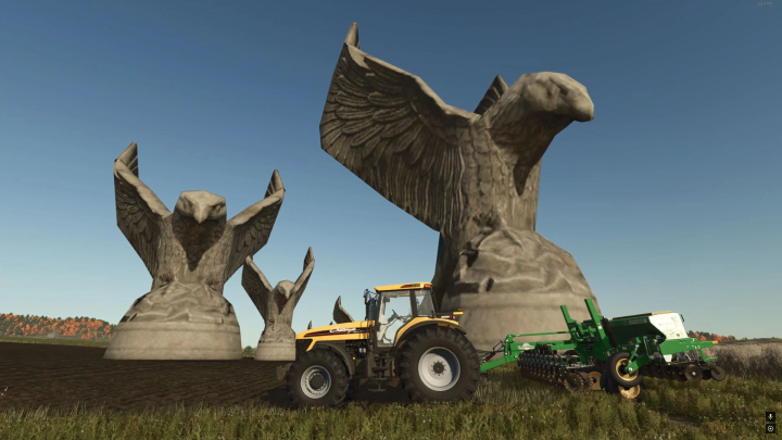 fs25-mods,  FS25 Giants Eagle Pack mod with tractor plowing near large eagle statues.