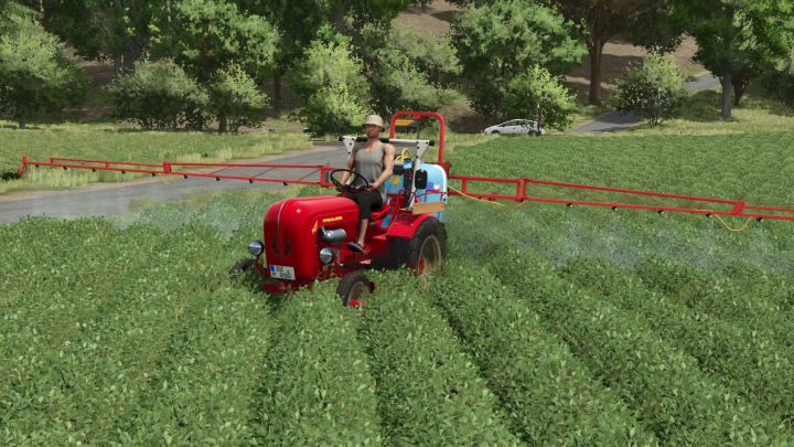 fs25-mods, FS25 mod Porsche Diesel Junior 108 spraying crops in Farming Simulator 25.