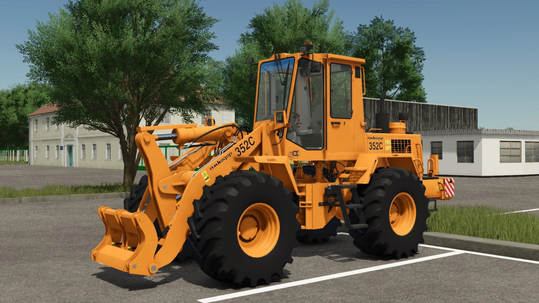 FS25 mod Amkodor-352S v1.0.0.0, an orange loader parked in a rural setting, enhancing Farming Simulator 25 gameplay.