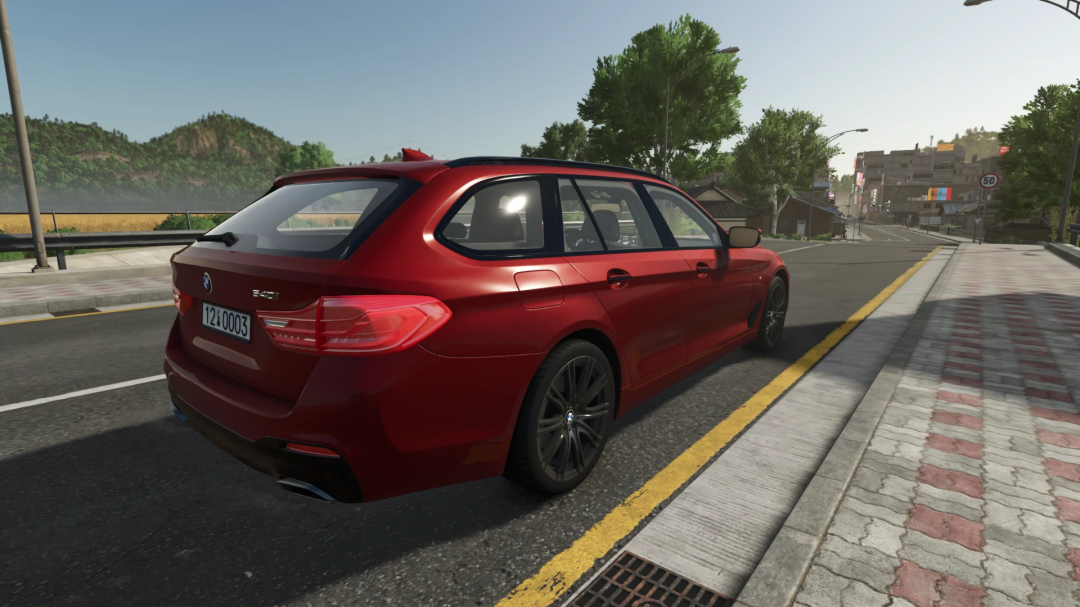 BMW 5 Touring G31 mod in FS25, showing a red car parked on a road within Farming Simulator 25 scenery.