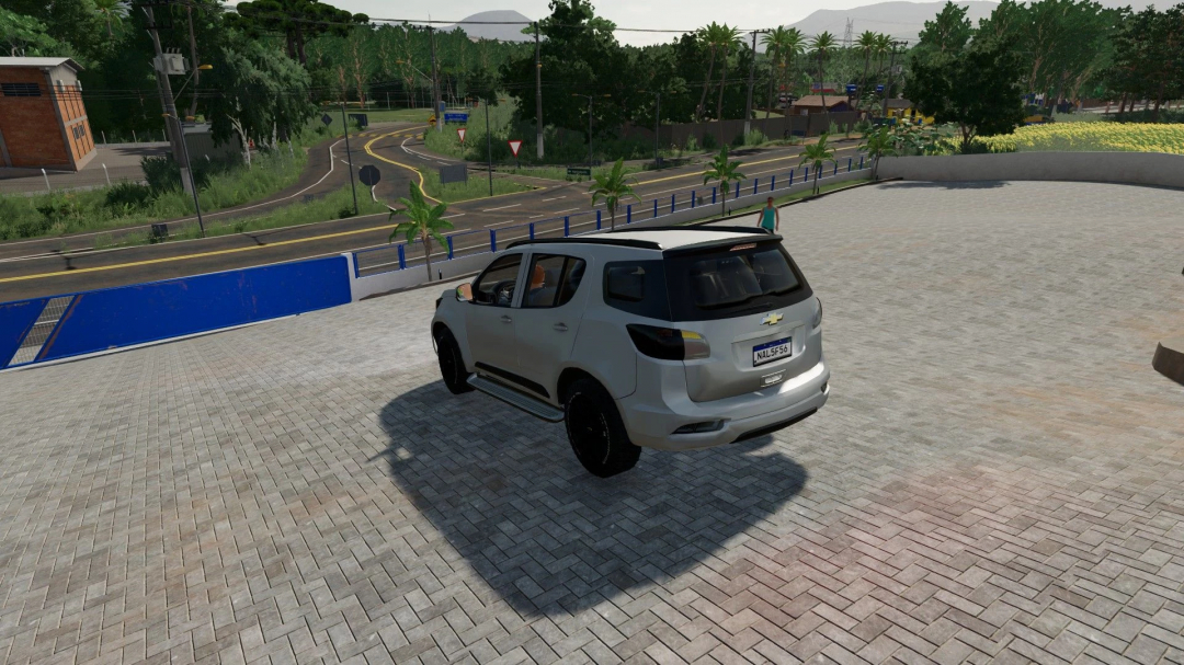 Chevrolet Blazer mod in FS22 on a paved courtyard with scenic background.