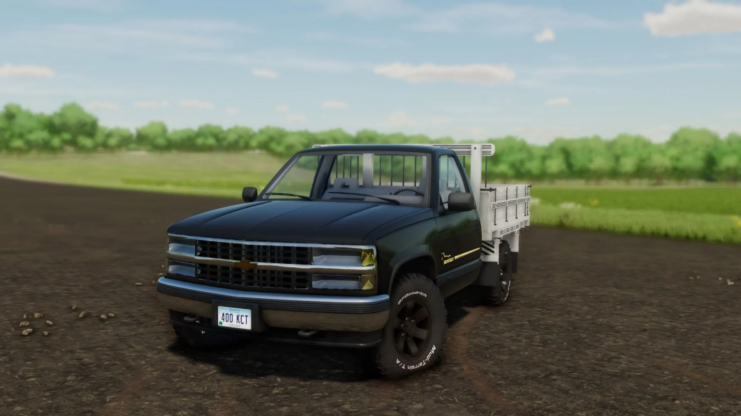 Chevrolet Silverado Farias mod in FS22, showcasing a detailed black pickup truck with a flatbed on a farm road.