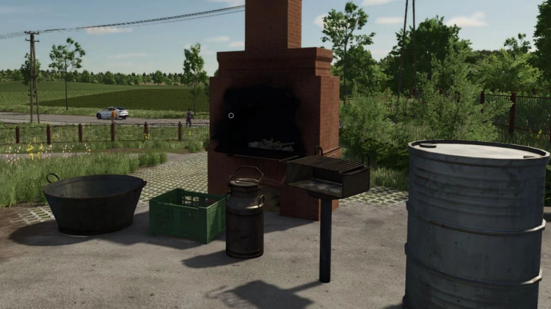 FS25 Decorations Pack 6 v1.0.0.0: outdoor BBQ setup with barrels, milk can, crate, and brick grill in a rural landscape.